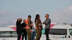 epa12449781 Israeli soldiers and hospital workers prepare ambulances and equipment to receive hostages released by Hamas at Shiba hospital in Ramat Gan, near Tel Aviv, Israel 13 October, 2025. The first phase of the Gaza peace agreement, reached between Israel and Hamas, includes the release of Israeli hostages and Palestinian prisoners, a partial withdrawal of Israeli forces, and the delivery of humanitarian aid to Gaza. EPA/ATEF SAFADI