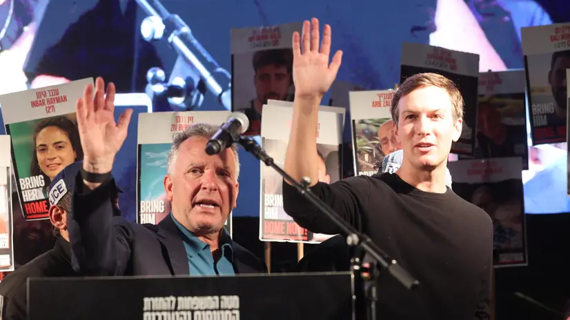 epa12447415 Steve Witkoff (L), United States special envoy to the Middle East and special envoy for Peace Missions, and Jared Kushner, son-in-law of US President Trump, wave on stage during a rally at the so-called 'Hostages Square' outside the Kirya military headquarters in Tel Aviv, Israel, 11 October 2025. Tens of thousands are to gather at the "Hostages Square" ahead of the release of hostages held by Hamas. EPA/ABIR SULTAN