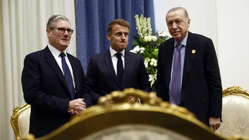 epa12450732 French President Emmanuel Macron (C) attends a meeting with Turkish President Recep Tayyip Erdogan (R) and British Prime Minister Keir Starmer (L) at the Gaza international peace summit in Sharm El-Sheikh, Egypt, 13 October 2025. US President Donald Trump alongside Egypt's President Abdel Fattah al-Sisi with leaders from more than 20 countries attend the summit in Sharm El-Sheikh. The first phase of Gaza peace plan between Israel and Hamas involves the release of Israeli hostages and Palestinian prisoners, the partial withdrawal of Israeli forces, and the delivery of humanitarian aid to Gaza. EPA/YOAN VALAT / POOL