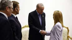 epa12450815 (L-R) British Prime Minister Keir Starmer, French President Emmanuel Macron, Turkish President Recep Tayyip Erdogan and Italian's Prime Minister Giorgia Meloni attend a bilateral meeting at the Gaza International Peace Summit in Sharm el-Sheikh, Egypt, 13 October 2025. US President Donald Trump alongside Egypt's President Abdel Fattah al-Sisi with leaders from more than 20 countries attend the summit in Sharm El-Sheikh. The first phase of Gaza peace plan between Israel and Hamas involves the release of Israeli hostages and Palestinian prisoners, the partial withdrawal of Israeli forces, and the delivery of humanitarian aid to Gaza. EPA/YOAN VALAT /POOL