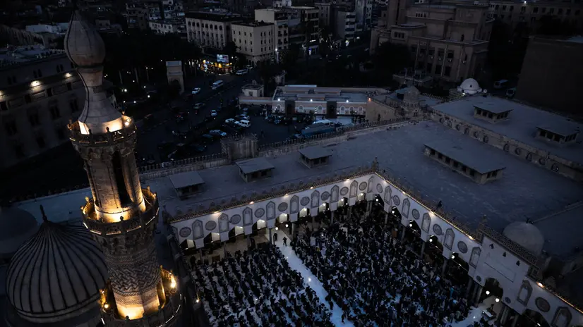 epa11952218 Muslims wait to break their fast during the holy month of Ramadan at Al-Azhar Mosque in Cairo, Egypt, 09 March 2025. Al-Azhar provides 5,000 daily iftar meals to Egyptian and international students in Al-Azhar Mosque's courtyard. EPA/MOHAMED HOSSAM