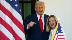epa12037068 US President Donald Trump (L) greets Italian Prime Minister Giorgia Meloni (R) at the White House, Washington, DC, USA, 17 April 2025. EPA/WILL OLIVER