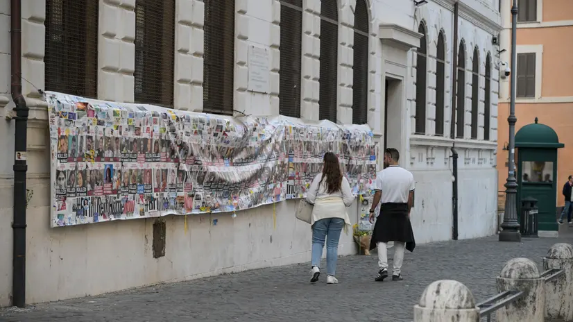Banner with faces of kidnapped and killed people in October 7 2023 attacks on a wall in the Jewish Ghetto in Rome, Italy, 9 October 2025. ANSA/RICCARDO ANTIMIANI