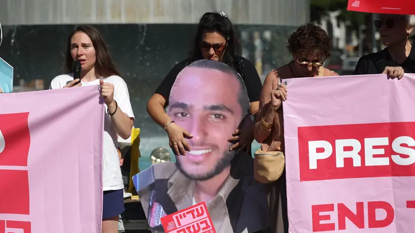 epa12436474 People holding pictures of Israeli hostages and victims of the October 7th attack at the fountain of Dizengoff Square in Tel Aviv, Israel, 07 October 2025. October 07 marks two years since the Palestinian militant group Hamas launched a surprise attack on Israel, taking dozens of hostages and killing nearly 1,200 people. In response, Israel began its war on Gaza, which has killed more than 66,000 people, displaced millions and destroyed the Palestinians enclave. EPA/ABIR SULTAN