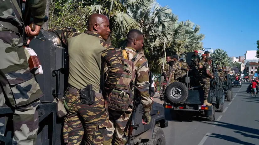 epa12453124 Members of the military ride transport vehicles in Antananarivo, Madagascar, 14 October 2025. Madagascar's president Andry Rajoelina has confirmed he has fled the country during an address to the nation on social media after, an elite military unit, CAPSAT joined the protesters over the weekend. Members of Parliament in the National Assembly have voted to impeach President Andry Rajoelina. EPA/HENITSOA RAFALIA