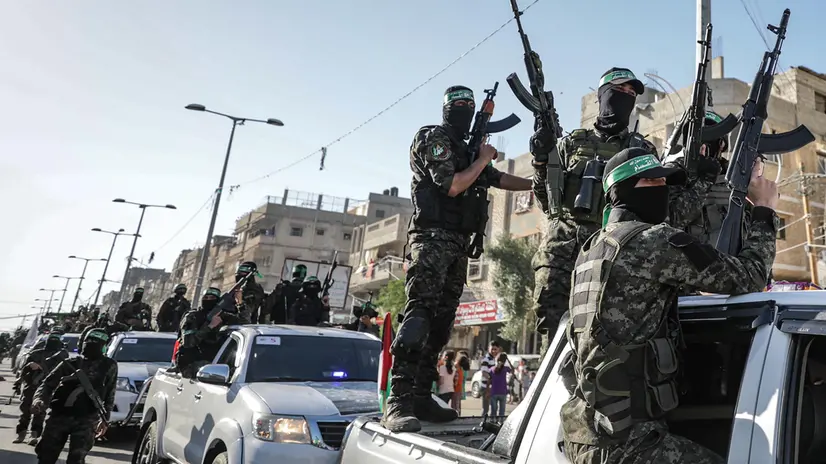 epaselect epa09232273 Izz ad-Din al-Qassam brigade fighters, the military wing of Hamas, parade to commemorate the al-Qassam fighters who were killed during the recent conflict in Gaza City, 27 May 2021 (issued 28 May 2021). After eleven days of fighting a ceasefire came into effect on 21 May between Israel and militants in the Gaza strip under an Egyptian initiative for an unconditional ceasefire. EPA/MOHAMMED SABER