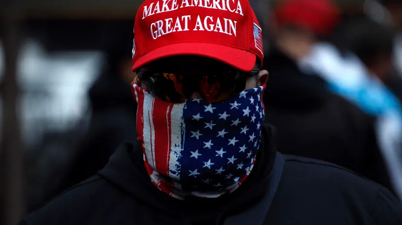 epa10534370 A Trump supporter attends a rally held by the New York Young Republicans outside of New York Criminal Court at a rally for Former President Donald Trump in New York, New York, USA, 20 March 2023. Former President Donald J. Trump posted on his social media platform that he expects to be formally indicted on 21 March, the Manhattan District Attorney's office investigating charges related to hush-money payments to porn star Stormy Daniels has declined to comment on any potential indictment. EPA/Peter Foley