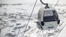 epa10969484 A gondola is pictured over Cervinia from "Plan Maison" area as the men's Downhill race is cancelled due the strong wind during the Alpine Skiing FIS Ski World Cup, between Zermatt in Switzerland and Cervinia in Italy, 11 November 2023. The new 'Gran Becca' course spans across the Swiss-Italian border. EPA/JEAN-CHRISTOPHE BOTT