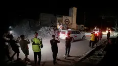 epa12456471 Vehicles of the International Committee of the Red Cross (ICRC) transporting remains of Israeli hostages handed over by Hamas leave in Gaza City, 15 October 2025. The first phase of the Gaza peace agreement, reached between Israel and Hamas, includes the release of Israeli hostages and Palestinian prisoners, a partial withdrawal of Israeli forces, and the delivery of humanitarian aid to Gaza. EPA/MOHAMMED SABER