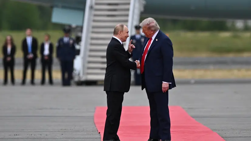 epaselect epa12303523 US President Donald Trump (R) welcomes Russian President Vladimir Putin during their meet to negotiate at Joint Base Elmendorf-Richardson in Anchorage, Alaska, USA, 15 August 2025. EPA/SERGEY BOBYLEV/SPUTNIK/KREMLIN POOL / POOL MANDATORY CREDIT
