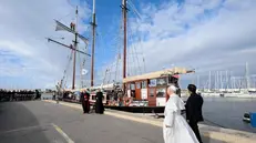 epa12460516 A handout picture provided by the Vatican Media shows Pope Leo XIV (2-R) arrives to visit the Peace training ship 'MED 25 - Bel Espoir', in the port of Ostia near Rome, Italy, 17 October 2025. The Mar Yam association, the AJD - Bel Espoir association and the diocese of Marseille organised the MED 25 - Bel Espoir odyssey for Peace from March to October 2025, with 8 months of navigation, many thematic conferences and festivals with 30 stopovers on the 5 shores of the Mediterranean, with 200 young people on board (in groups of 25), of all faiths and religions. EPA/VATICAN MEDIA HANDOUT HANDOUT EDITORIAL USE ONLY/NO SALES