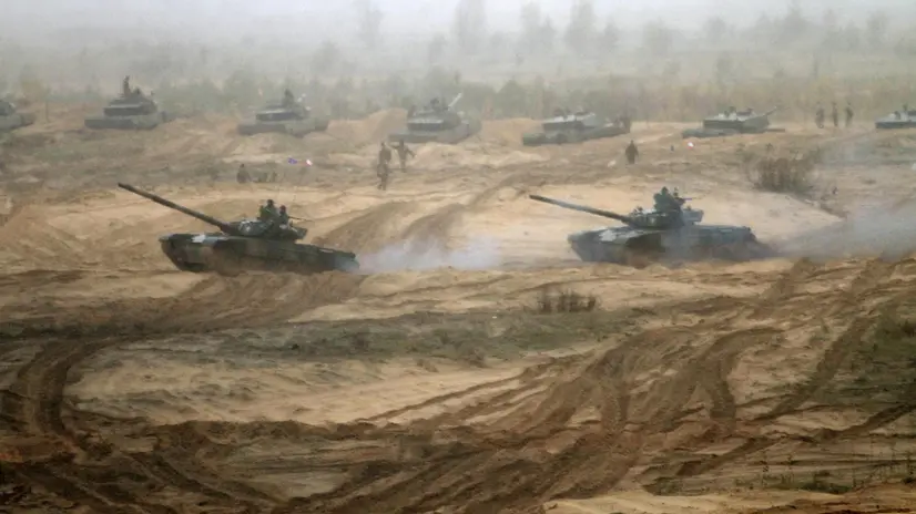 epa07114265 Polish soldiers with their battle tanks PT-91 Twardy take part in gunnery shoot-off between the Enhanced Forward Presence nations at the military exercise Iron Tomahawk in Adazi Military Base, Latvia, 23 October 2018. The countries participating in the military exercise are Germany, Spain, Poland, UK and the US. EPA/VALDA KALNINA