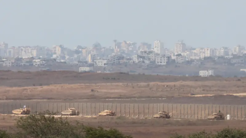 epa11645083 A convoy of Israeli armoured vehicles makes its way to the northern Gaza Strip, as seen from the border with Gaza in southern Israel, 06 October 2024. Israel's military stated on 06 October, they have been conducting since last night an 'operation to systematically dismantle terrorist infrastructure' in the area of Jabalia, in the northern Gaza Strip. The Israel Air Force conducted strikes on dozens of military targets in order to assist IDF ground troops operating in the area, the statement added. EPA/ABIR SULTAN