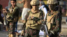 epa12461210 Houthi soldiers patrol a street in Sana'a, Yemen, 17 October 2025. Houthi leader Abdul-Malik al-Houthi, in a televised address, has accused UN personnel, detained by his group, of spying for Israel and identifying targets for the Israeli bombings that killed Houthi Prime Minister Ahmed al-Rahawi and a dozen members of his cabinet on 28 August 2025. Yemen's Houthis detained nine UN staff members and humanitarian partners earlier in October, bringing the total number of arbitrarily detained aid workers to 53 since 2021, according to the United Nations. EPA/YAHYA ARHAB