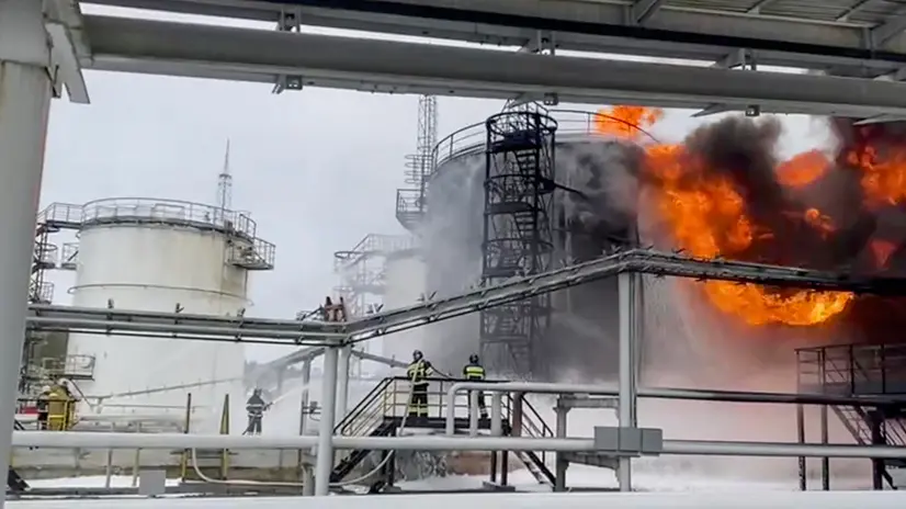epa11089529 A still image taken from a handout video provided  by the Russian Emergencies Ministry Press-Service shows Russian firefighters extinguishing a fire following a reported drone attack on the territory of the Klintsevskaya oil depot, near Bryansk, Bryansk region, Russia, 19 January 2024. Oil storage tanks caught fire after a Ukrainian drone attacked an oil depot in Klintsy, Russia's Bryansk region, regional governor Aleksandr Bogomaz wrote on telegram, adding that there were no casualties in the incident. Some 32 residents of the private sector were temporarily evacuated and more than 140 people were deployed to fight the fire. EPA/RUSSIAN EMERGENCIES MINISTRY HANDOUT -- BEST QUALITY AVAILABLE -- HANDOUT EDITORIAL USE ONLY/NO SALES HANDOUT EDITORIAL USE ONLY/NO SALES