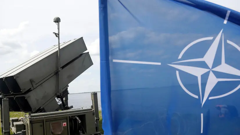 epa12141043 Spanish air defense missile system (NASAMS) and NATO flag are seen during Media Day at the 'Latvian Shield 25' exercise at the Riga Hydroelectric Power Plant in Dole, Latvia, 28 May 2025. The exercise strengthens cooperation between Spanish and Latvian Air Force air defense units, enhancing the ability of Latvian and other NATO forces to jointly respond to air defense challenges. EPA/TOMS KALNINS