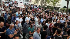 epa12481950 People hold placards and chant slogans during a protest demanding the closure of chemical factories in the Ghannouch industrial zone in Gabes, in Tunis Tunisia, 25 October 2025. Civil society groups organized the rally after a surge in poisoning cases linked to toxic discharges from a government-run chemical complex that produces phosphate fertilizers. EPA/MOHAMED MESSARA