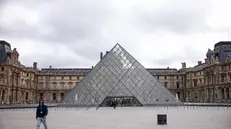 epa12466942 An exterior view of the Louvre Museum a day after a robbery in Paris, France, 20 October 2025. The Louvre Museum was targeted in a robbery by several criminals who smashed windows to steal eight priceless royal pieces of jewelry on 19 October. The Louvre remains closed for a second day running. French Culture Minister Rachida Dati called it 'an attack on France’s cultural heritage.' EPA/YOAN VALAT