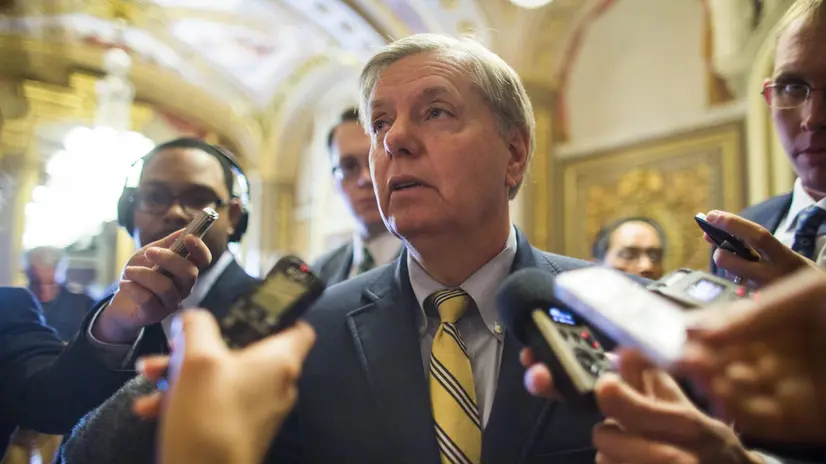 epa03960014 Republican Senator from South Carolina Lyndsey Graham speaks to the media after the Senate passed the so-called 'nuclear option,' which changes the Senate rules to eliminate the use of the filibuster on presidential nominees, except those to the Supreme Court, in the US Capitol in Washington, DC, USA 21 November 2013. EPA/JIM LO SCALZO