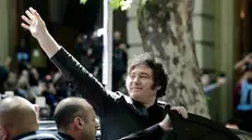 epa12484153 Argentinian President Javier Milei waves outside a polling station within the National Technological University, in Buenos Aires, Argentina, 26 October 2025. Argentina is holding nationwide legislative elections, with about half of the seats in the Chamber of Deputies and one-third in the Senate up for renewal. EPA/JUAN IGNACIO RONCORONI