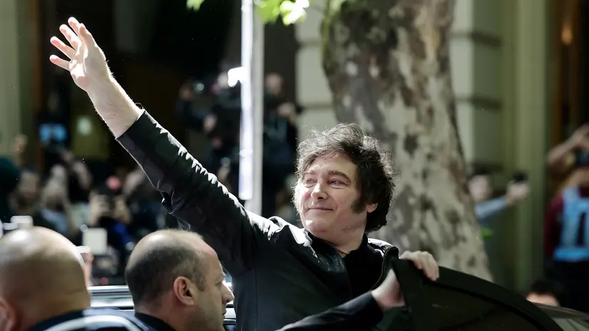 epa12484153 Argentinian President Javier Milei waves outside a polling station within the National Technological University, in Buenos Aires, Argentina, 26 October 2025. Argentina is holding nationwide legislative elections, with about half of the seats in the Chamber of Deputies and one-third in the Senate up for renewal. EPA/JUAN IGNACIO RONCORONI