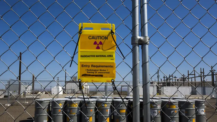epa04774085 Hazardous waste is seen in barrels outside of the Hanford Site's Plutonium Finishing Plant, where workers used to turn liquid plutonium into hockey puck-sized plutonium buttons for nuclear weapons production, on the Hanford Site in Hanford, Washington, USA, 28 May 2015. Established near the end of WW II during the Manhattan Project, the Hanford Site is one of the the most toxic nuclear sites in the Western Hemisphere. The federal cleanup effort at the sprawling complex is expected to last until the year 2060 and cost American taxpayers $150 billion dollars (146 billion Euros). EPA/JIM LO SCALZO