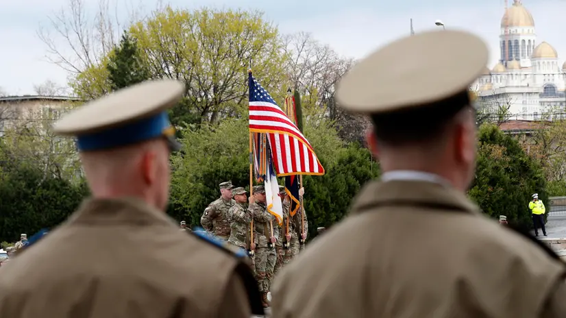 epa10560096 Servicemen of the 101st Airborne Division hold the battle flag of the unit while attending the transfer of authority ceremony between the 101st Airborne Division (Air Assault) and the 10th Mountain Division, both of the US Army, at the Heroes Memorial in front of the 'Carol I' National Defense University in Bucharest, Romania, 05 April 2023. The battle flag of the 101st Airborne Division was decorated with the National Order 'Faithful Service' in the rank of Knight of Romania. Approximately 4,700 soldiers from the 101st Airborne have been deployed to various locations across Europe, from which 2,400 are located in Romania. EPA/ROBERT GHEMENT