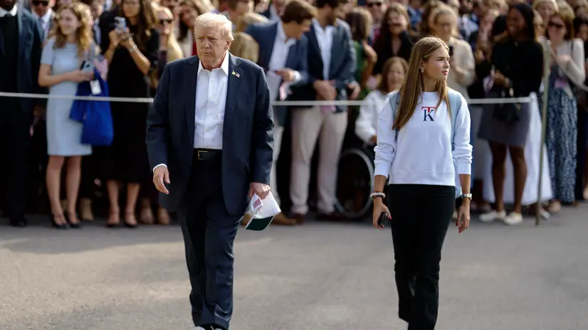 epa12407984 US President Donald Trump (L) with granddaughter Kai Madison Trump (R) as they leave the White House to board Marine One, in Washington DC, USA, 26 September 2025. President Trump is travelling to the Ryder Cup in Bethpage State Park in Farmingdale, New York. EPA/WILL OLIVER