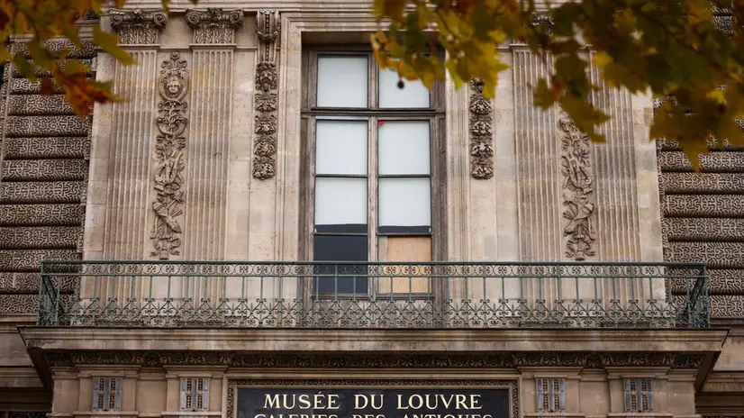epa12466938 An exterior view of the broken window a day after a robbery at the Louvre Museum in Paris, France, 20 October 2025. The Louvre Museum was targeted in a robbery by several criminals who smashed windows to steal eight priceless royal pieces of jewelry on 19 October. The Louvre remains closed for a second day running. French Culture Minister Rachida Dati called it 'an attack on France’s cultural heritage.' EPA/YOAN VALAT