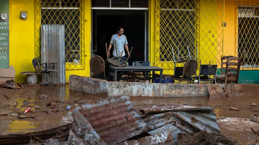 epa12494416 A person cleans belongings affected by Hurricane Melissa; in Santa Cruz, Jamaica, 30 October 2025. The Caribbean Public Health Agency (CARPHA) pledged to provide essential supplies to Jamaica after Hurricane Melissa, a category 5 storm, hit the southwestern part of the country on Tuesday. At least 19 people are dead, more than 70 percent of customers remain without electricity and 134 roads are blocked in Jamaica due to the destruction caused by Hurricane Melissa. EPA/Orlando Barría