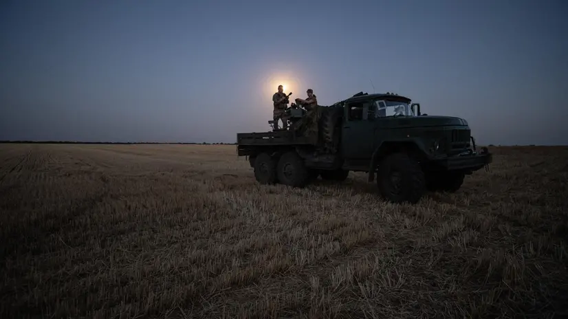 epaselect epa12227146 Two soldiers from a Ukrainian Army anti-aircraft artillery brigade scan their sector for Shahed drones on Ukraine's southern frontline on the night Russia launched the largest combined airstrike since it began its full-scale invasion of Ukraine, 08 July 2025. The unit operates a truck-mounted ZU-23-2 air defence system with a twin 23-calibre gun capable of targeting objects flying below 2,500 metres. EPA/Maria Senovilla