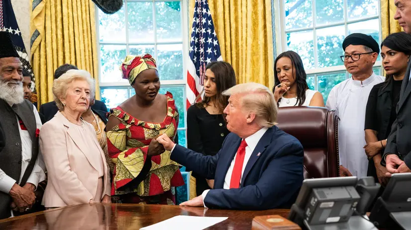 epa07723559 US President Donald J. Trump shakes hands Esther Bitrus, of Nigeria, as he meets with survivors of religious perception in the Oval Office at the White House in Washington, DC, USA, 17 July 2019. EPA/KEVIN DIETSCH / POOL