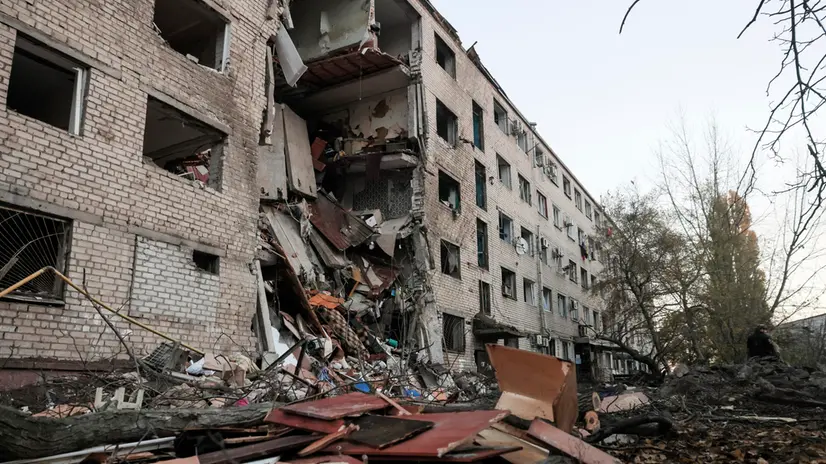 epa12492671 Ukrainian rescuers work at the site of a Russian strike on a residential area in Zaporizhzhia, southeastern Ukraine, 30 October 2025, amid the Russian invasion. At least one person was killed and 15 others were injured, including 4 children, after a Russian strike on Zaporizhzhia, according to the State Emergency Service report. EPA/OLEG MOVCHANIUK