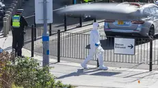 epa12498850 Forensic teams work at the scene at Huntington railway station, where a London-bound train stopped after several people were stabbed in Huntington, Britain, 02 November 2025. Multiple people were stabbed on a train going from Doncaster to London. Ten people were initially taken to hospital; two people remain in a life-threatening condition. Two British nationals have been taken into custody in connection with the incident, according to police. EPA/TAYFUN SALCI