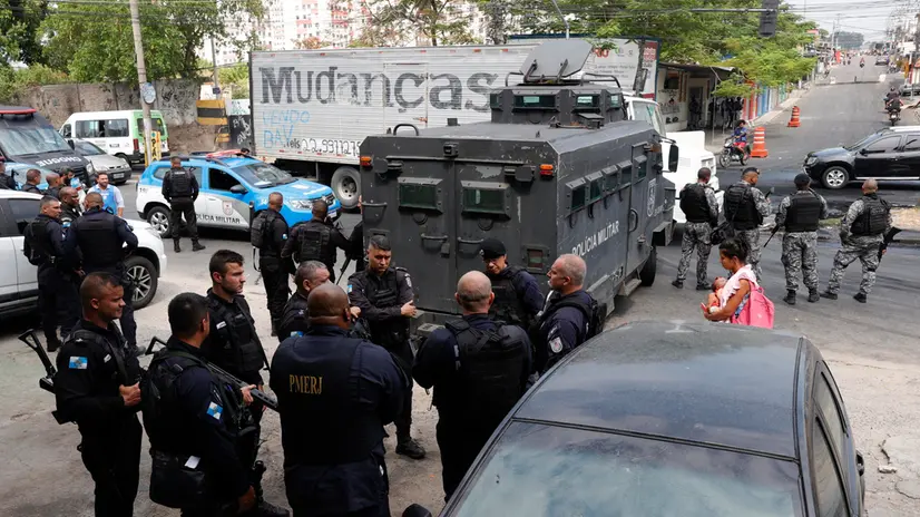 epa11961795 Members of Brazil's Military Police take part in an operation in the Chapadao favela complex in Rio de Janeiro, Brazil, 13 March 2025. Residents of Chapadao protested after the death of a man during a confrontation between military police and drug traffickers in the region. EPA/ANDRE COELHO