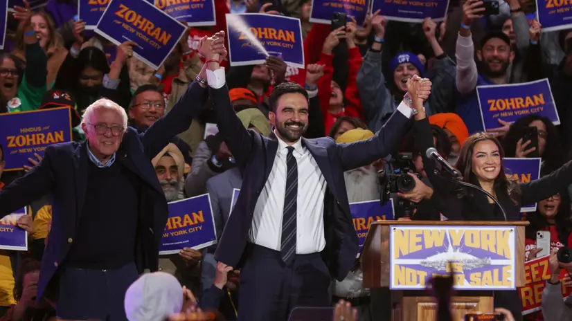 epa12485053 (L-R) Senator Bernie Sanders, Democratic nominee for the mayor of New York City Zohran Mamdani and US Representative Alexandria Ocasio-Cortez hold hands in solidarity during the 'New York Is Not For Sale' rally at Forest Hills Stadium in the Queens borough of New York, New York, USA, 26 October 2025. The event, hosted by Democratic frontrunner in the New York City mayoral race Zohran Mamdani, will feature Senator Bernie Sanders and US Representative Alexandria Ocasio-Cortez, ahead of Election Day for New York City mayor on 04 November. EPA/SARAH YENESEL