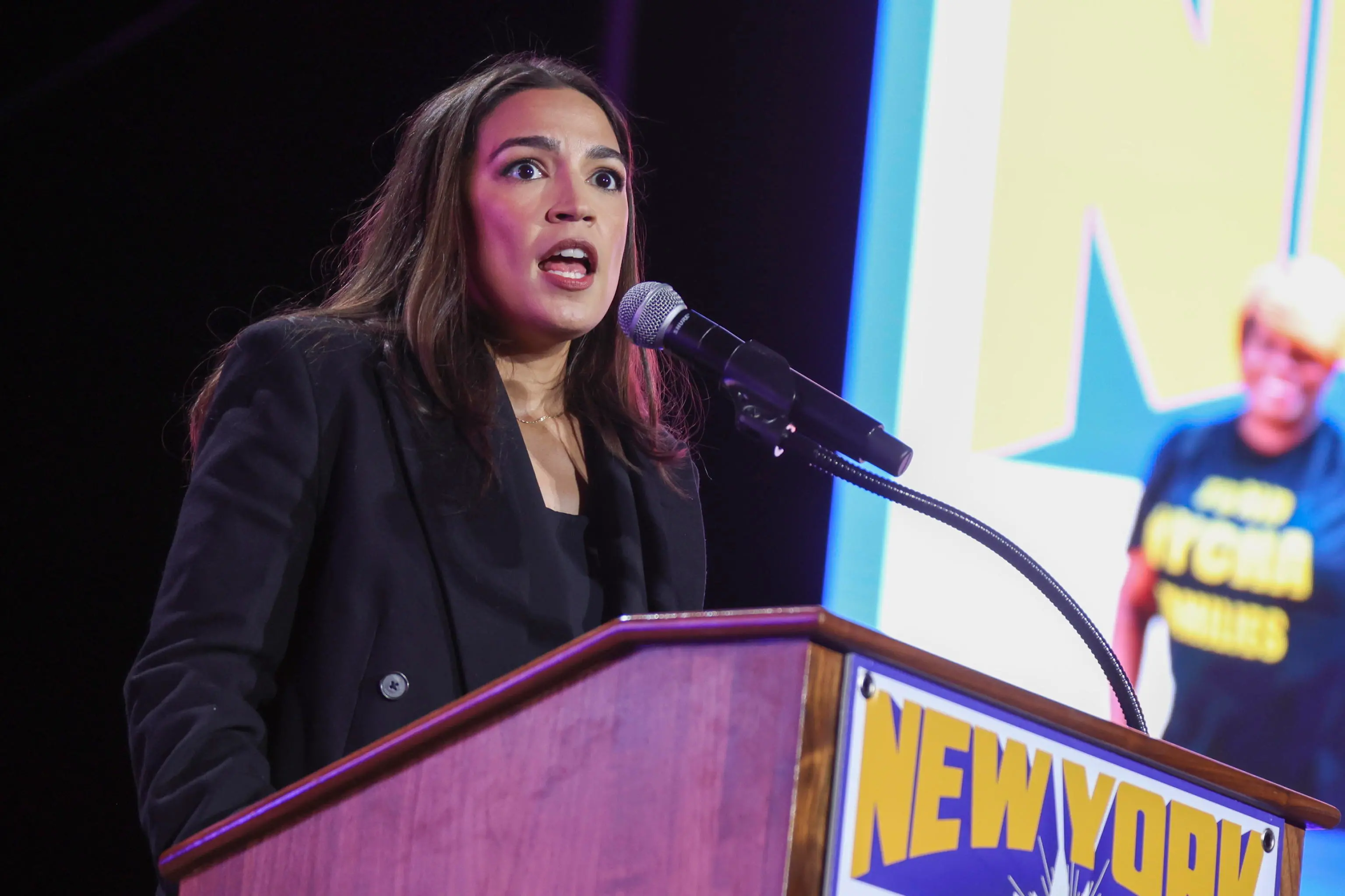 epa12486256 US Representative Alexandria Ocasio-Cortez (C) speaks during the 'New York Is Not For Sale' rally at Forest Hills Stadium in the Queens borough of New York, New York, USA, 26 October 2025 (issued 27 October 2025). The event was hosted by Democratic frontrunner in the New York City mayoral race Zohran Mamdani ahead of Election Day for New York City mayor on 04 November. EPA/SARAH YENESEL
