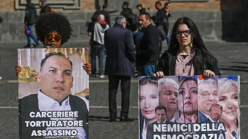 Attivisti della Rete Nazionale No Ddl Sicurezza - “A Pieno Regime” in piazza del Plebiscito a Napoli protestano esponendo i volti dei ministri Nordio e Valditara, dei leader europei, di Elon Musk e Almasri ed annunciano un corteo per domani sabato 22 febbraio, 21 febbraio 2025 ANSA / CIRO FUSCO