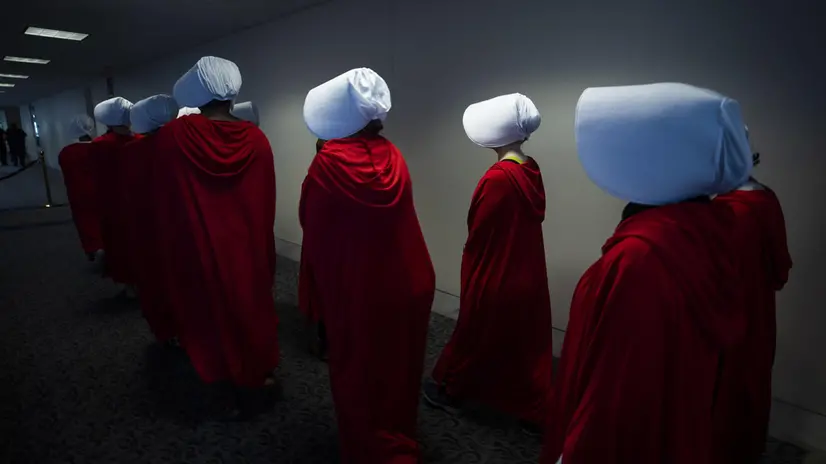 epaselect epa06998617 Protestors dressed in costumes from the dystopian novel The Handmaid's Tale gather outside the Senate confirmation hearting of circuit judge Brett Kavanaugh to be an Associate Justice of the Supreme Court of the United States in the Hart Senate Office Building in Washington, DC, USA, 05 September 2018. President Trump nominated Kavanaugh to fill the seat of retiring justice Anthony Kennedy. If confirmed, Kavanaugh would give conservatives a five-member majority in the high court. EPA/JIM LO SCALZO