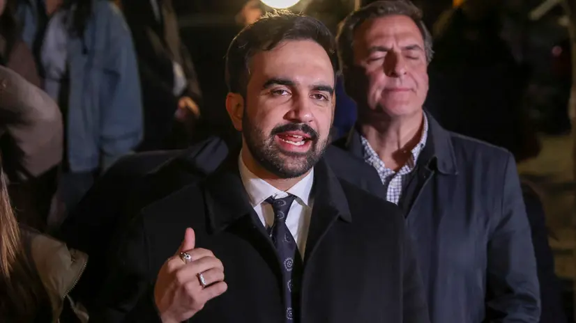 epa12501518 Democratic nominee for New York City mayor Zohran Mamdani (C) speaks to the press at a canvas launch in the Queens borough of New York, New York, USA, 03 November 2025. Volunteers signed up to canvas in Astoria the day before Election Day for Mamdani. EPA/SARAH YENESEL