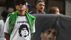 epa11956055 Diego Armando Maradona's supporters wait in front of the San Isidro courthouse in Buenos Aires, Argentina, 11 March 2025. Diego Armando Maradona's daughters, Dalma, Giannina, and Jana, arrived at the Criminal Court Number 3 of San Isidro, province of Buenos Aires, to attend the first hearing of the trial for the death of their father. EPA/JUAN IGNACIO RONCORONI