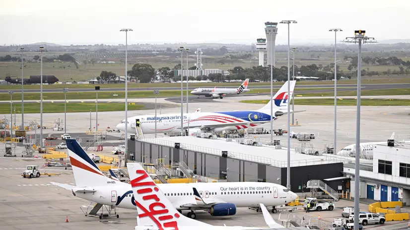 epa11488655 Jetstar, Malaysia Airlines, Rex Airlines and Virgin Australia planes are seen at Melbourne Airport, Australia, 20 July 2024. Companies and institutions around the world have been affected on 19 July by a major computer outage in systems running Microsoft Windows linked to a faulty CrowdStrike cyber-security software update. According to CrowdStrike’s CEO, the issue has been identified, isolated and a fix has been deployed. EPA/JAMES ROSS AUSTRALIA AND NEW ZEALAND OUT