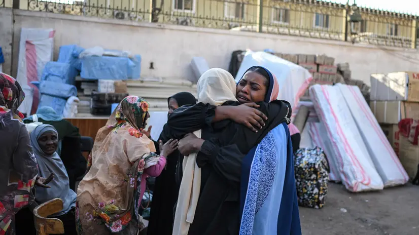 epaselect epa12031079 Sudanese women refugees react at an assembly point for buses arranged for their voluntary return from Egypt to Sudan, in Cairo, Egypt, 12 April 2025 (issued 14 April 2025). Between 30 to 40 buses leave daily from different points of the Egyptian capital towards the border with Sudan, with about 1,500 passengers, according to data from local transport companies. Sudanese refugees have been gradually returning to their country after Sudan’s army regained control of the capital Khartoum from paramilitary fighters of the Rapid Support Forces (RSF) in late March 2025. According to the UNHCR, over three million people have fled Sudan to neighboring countries since the outbreak of an armed conflict in April 2023. Egypt alone is estimated to have received more than half of them, according to government figures. EPA/MOHAMED HOSSAM