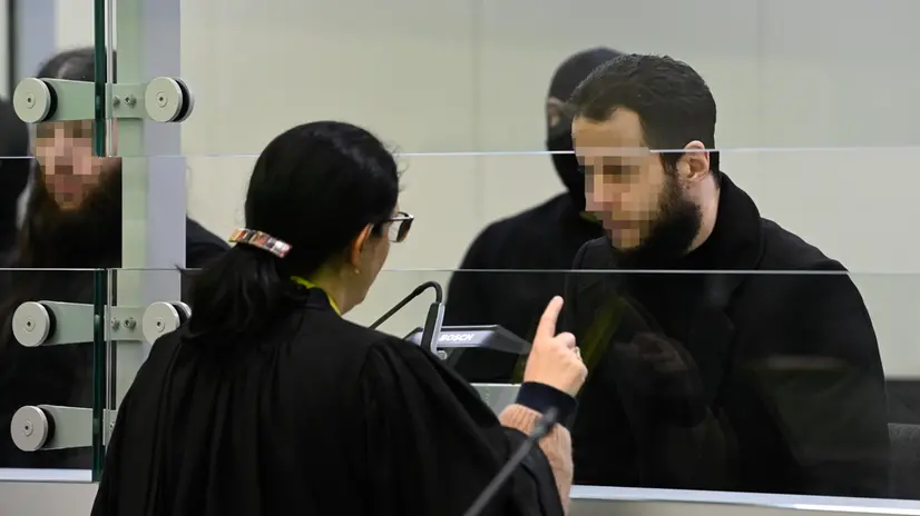 epa10556643 Defendant Salah Abdeslam talks with his lawyer in court during the trial of the 2016 Brussels terror attacks, at the Justitia building in Brussels, Belgium, 03 April 2023. Nine defendants are on trial over the March 22, 2016, bomb attacks at Brussels' Zaventem airport and Maelbeek metro station, that killed 32 people, and which were claimed by the Islamic State (IS) extremist group. EPA/JOHN THYS / POOL ATTENTION EDITORS: Faces pixelated at source MAXPPP OUT
