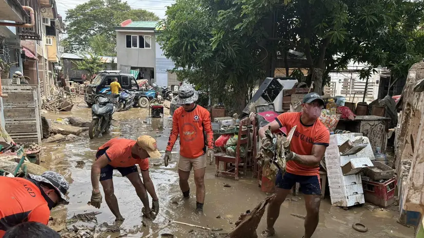 epa12509836 A handout photo made available by the Coast Guard District Central Visayas of the Philippine Coast Guard shows Coast Guard personnel conducting clearing operations in areas affected by Typhoon Kalmaegi in Talisay City, Cebu province, Philippines, 07 November 2025. Philippines' President Marcos Jr. approved the declaration of a state of national calamity following the effects of Typhoon Kalmaegi. The death toll has reached 152, according to the National Disaster Risk Reduction and Management Council. EPA/COAST GUARD DISTRICT CENTRAL VIS HANDOUT HANDOUT EDITORIAL USE ONLY/NO SALES