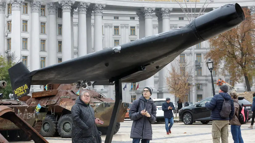 epa12478798 People look at debris of a Russian shock drone 'Geran-2', as part of destroyed Russian military equipment on display in Kyiv, Ukraine, 24 October 2025, amid the ongoing Russian invasion. EPA/SERGEY DOLZHENKO
