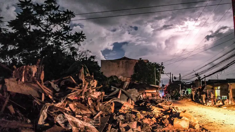 epa12507895 Debris from flood caused by typhoon Kalmaegi are piled up along a road at a residential district in Liloan municipality, Cebu province, Philippines, 06 November 2025. The Philippines' Office of Civil Defense stated that 114 have been reported dead following the effects of Typhoon Kalmaegi, which crossed the Visayas region of central Philippines on 04 November. The typhoon brought on floods, power outages, and damage to property before leaving Philippine territory and moving in the general direction of Vietnam. EPA/JUANITO ESPINOSA