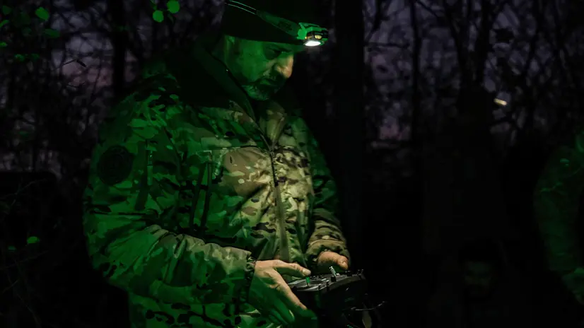epa12501029 A pilot from the Predator Brigade's unmanned vehicle unit of the Ukrainian Patrol Police in Donetsk prepares to launch a GARA bomber drone on a nighttime strike mission against Russian forces on the Pokrovsk front line, Ukraine, 02 November 2025 (issued 03 November 2025). Russian offensives have intensified in the area in recent weeks. EPA/MARIA SENOVILLA