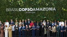 epa12510729 The COP30 heads of state and governments take part in a family photo during the COP30 leaders' summit in Belem, Brazil, 07 November 2025. The summit precedes the main 30th United Nations Climate Change Conference, running from 10 to 21 November in Belem, the gateway to the Amazon rainforest. EPA/ANTONIO LACERDA