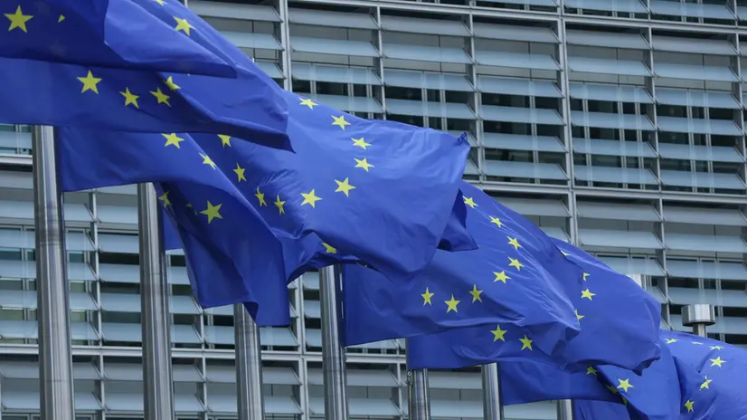 epa12276806 European Union flags at the European commission headquarters in Brussels, Belgium, 01 August 2025. U.S. President Donald Trump signed an executive order imposing tariffs of 15 percent on most EU goods and up to 41 percent to other countries. The tariffs take effect on 07 August 2025, a one-week delay to allow more time for negotiations. EPA/OLIVIER HOSLET